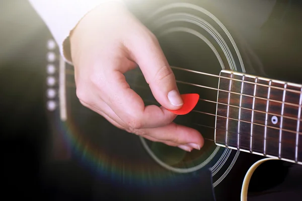 Acoustic guitar in female hands — Stock Photo, Image