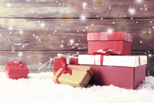 Christmas gift boxes on wooden background — Stock Photo, Image