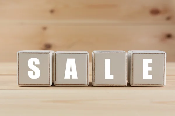 SALE spelled in wooden blocks — Stock Photo, Image