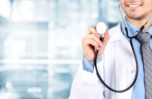 Male Doctor on hospital background — Stock Photo, Image