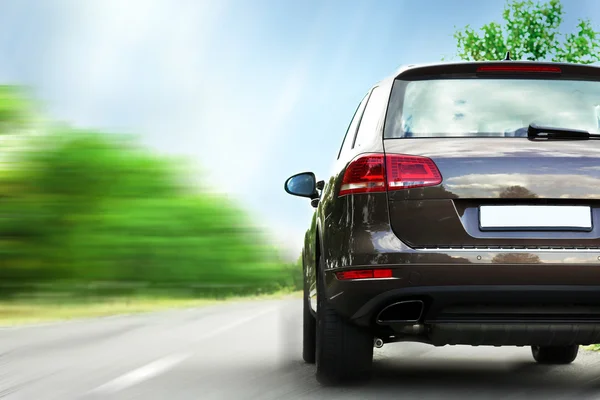 Speed concept. Modern car driving on road Stock Photo