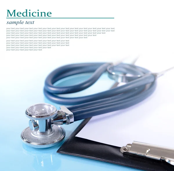Stethoscope and other things on light background Royalty Free Stock Photos