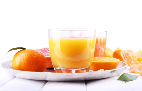 Grapefruit and tangerine juices on wooden table — Stock Photo, Image