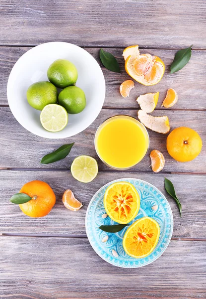 Juice and citrus on table — Stock Photo, Image