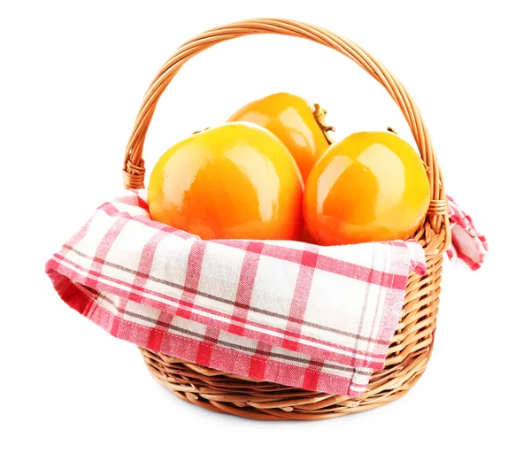 Ripe persimmons in wicker basket isolated on white — Stock Photo, Image