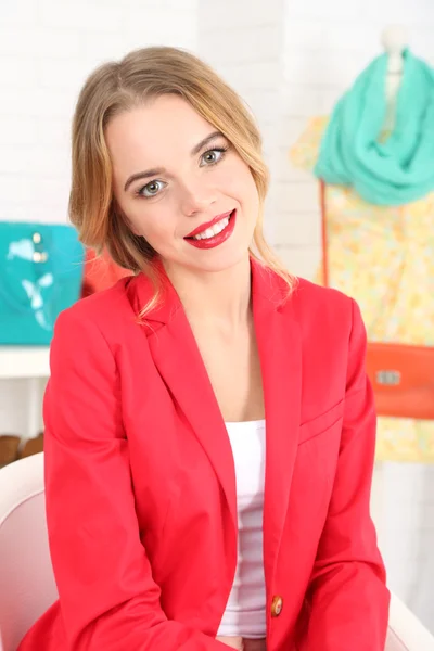 Beautiful young dressmaker in workroom — Stock Photo, Image