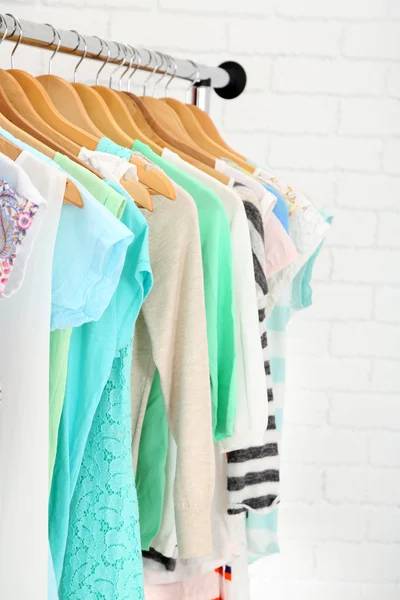 Different clothes on hangers close up — Stock Photo, Image