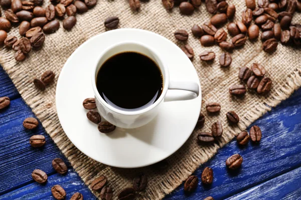 Cup of coffee on wooden table — Stock Photo, Image