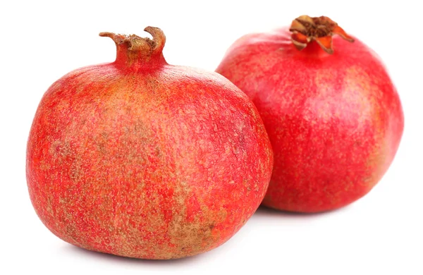 Saftige reife Granatäpfel, isoliert auf weiß — Stockfoto