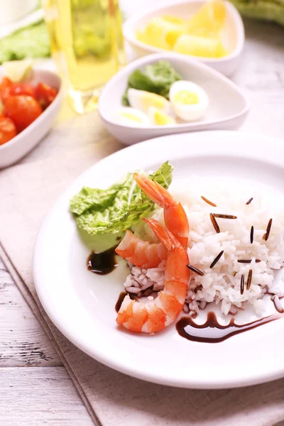 Boiled rice with shrimps served on table, close-up — Stock Photo, Image