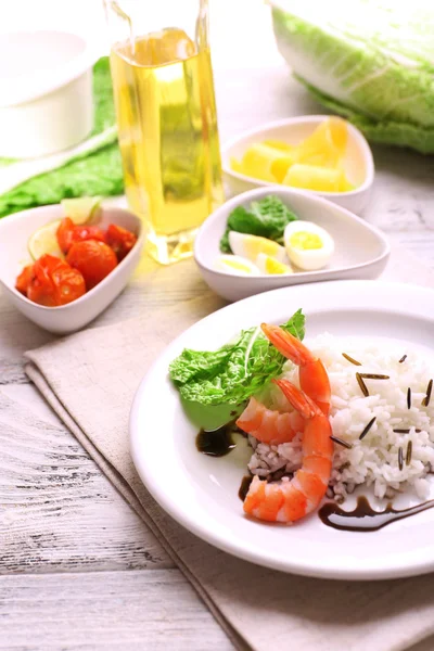 Boiled rice with shrimps served on table, close-up — Stock Photo, Image