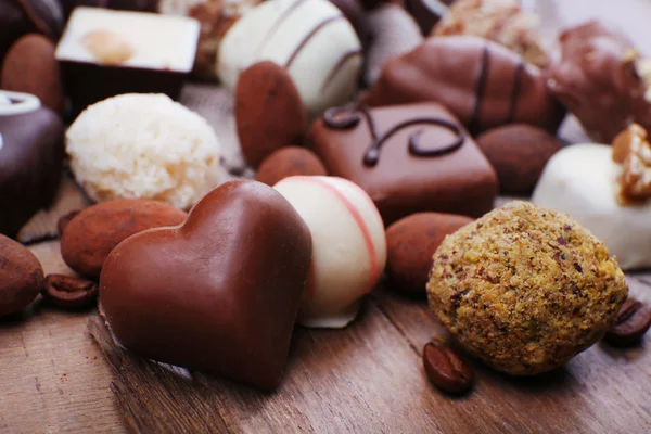 Different chocolates with coffee beans — Stock Photo, Image