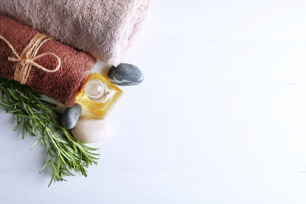 Branches of rosemary with towels — Stock Photo, Image