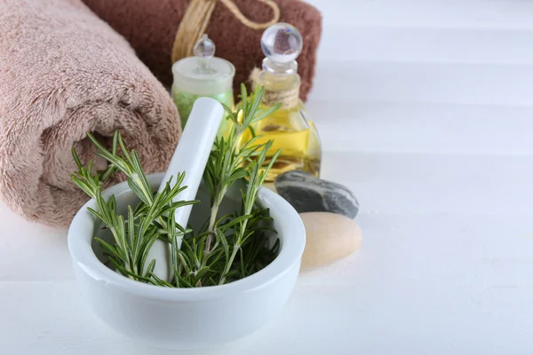 Branches of rosemary with towels — Stock Photo, Image