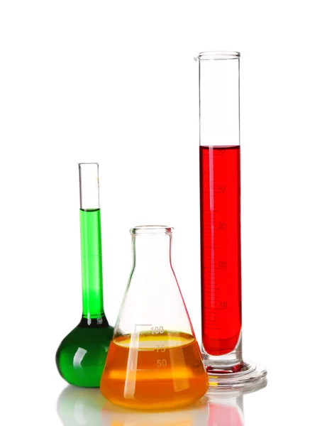 Test-tube and flasks with colorful fluid on table isolated on white — Stock Photo, Image