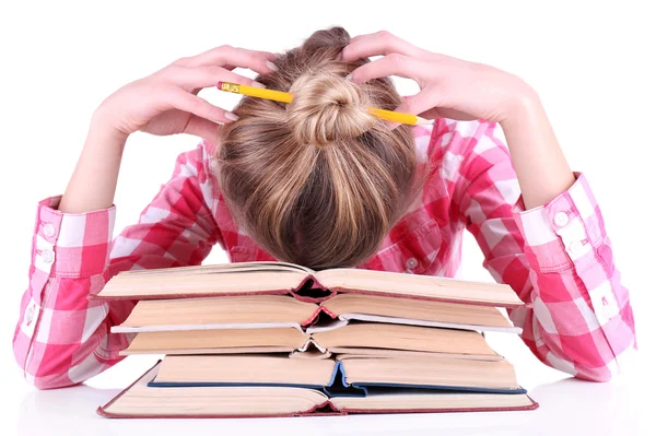 Müdes Mädchen mit Büchern auf weißem Grund — Stockfoto