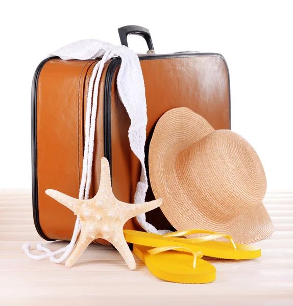 Vintage valise with summer items on wooden board — Stock Photo, Image