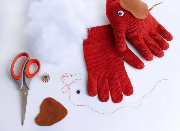 Making of handmade toys from gloves isolated on white — Stock Photo, Image