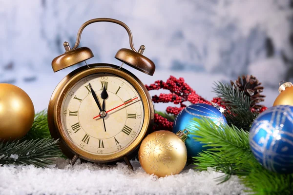 Alarm clock with Christmas decorations — Stock Photo, Image