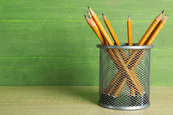 Pencils in metal holder — Stock Photo, Image