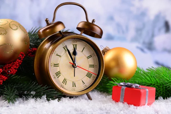 Alarm clock with Christmas decorations — Stock Photo, Image