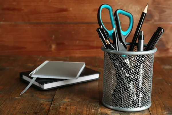 Metal holder with pens, pencil and scissor — Stock Photo, Image