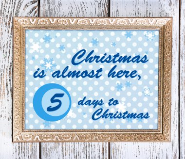 Ahşap arka plan karede ile Noel tebrik kartı