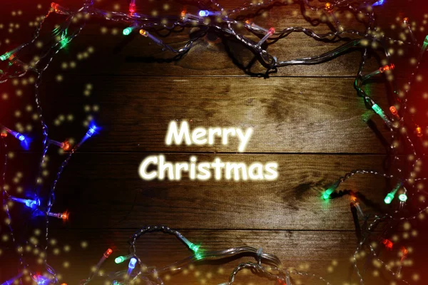 Luci di Natale su sfondo di legno — Foto Stock