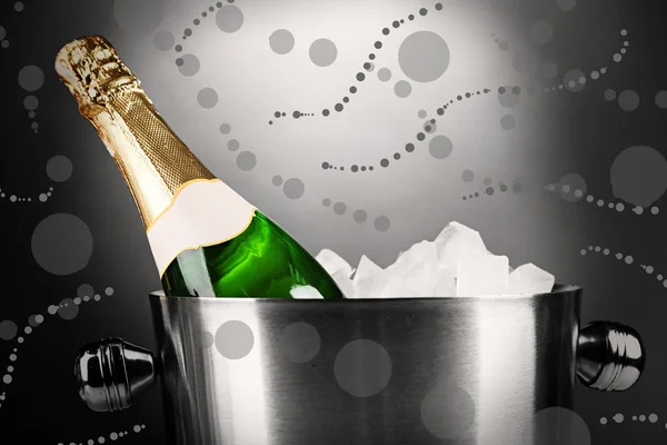 Bottle of champagne in bucket with ice — Stock Photo, Image