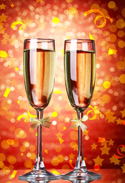 Glasses of champagne on bright background — Stock Photo, Image