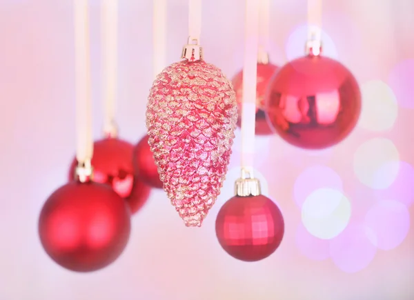 Christmas decorations hanging on festive background Stock Image