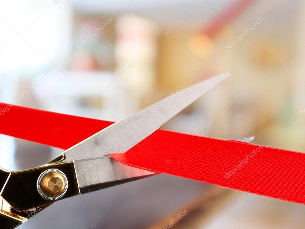 Cutting red ribbon