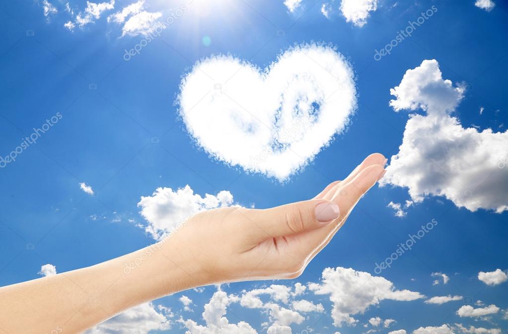 Heart clouds shape floating on hand