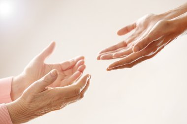 Helping hands, care for the elderly concept clipart