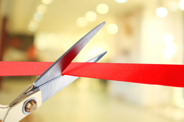 Grand opening, cutting red ribbon