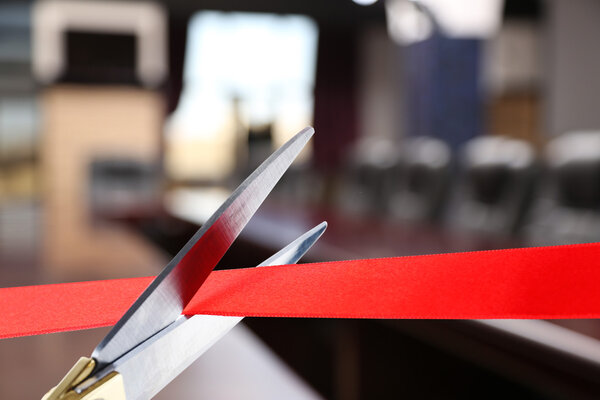 Grand opening, cutting red ribbon