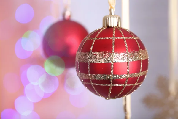 Christmas decorations hanging on festive background — Stock Photo, Image