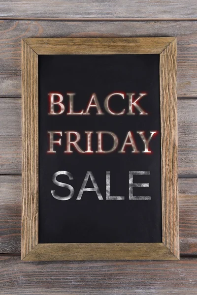 Vintage sign board with Black Friday Sale text on it on wooden background — Stock Photo, Image