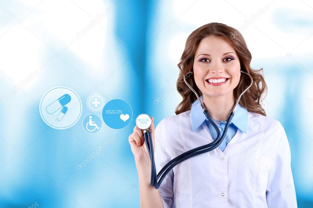 Female doctor with stethoscope and virtual screen