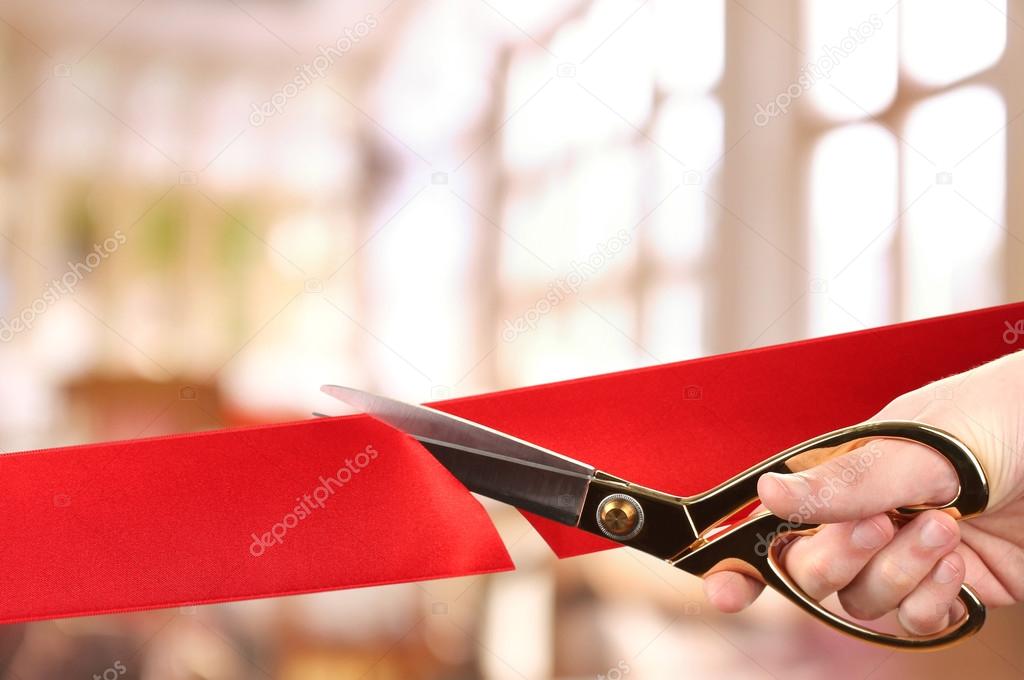 Grand opening, cutting red ribbon