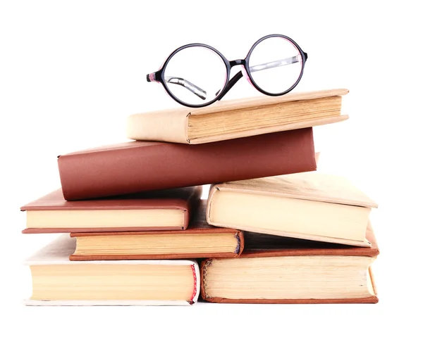 Books in a mess and glasses isolated on white — Stock Photo, Image