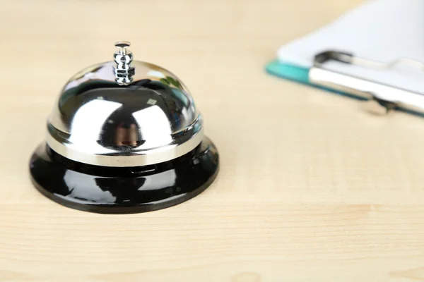 Reception bell on hotel reception desk — Stock Photo, Image