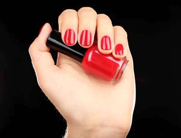 Nail polish in hand — Stock Photo, Image