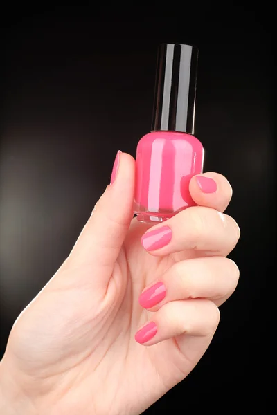 Nail polish in hand — Stock Photo, Image