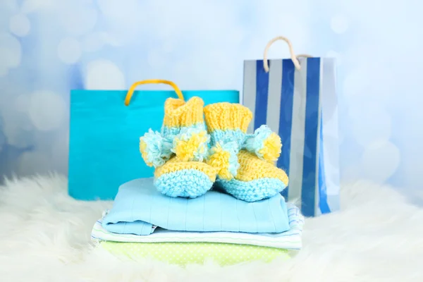 Baby clothes and gift bag — Stock Photo, Image