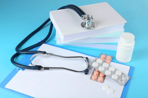 Medical stethoscope with books — Stock Photo, Image