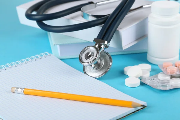 Medical stethoscope with books — Stock Photo, Image