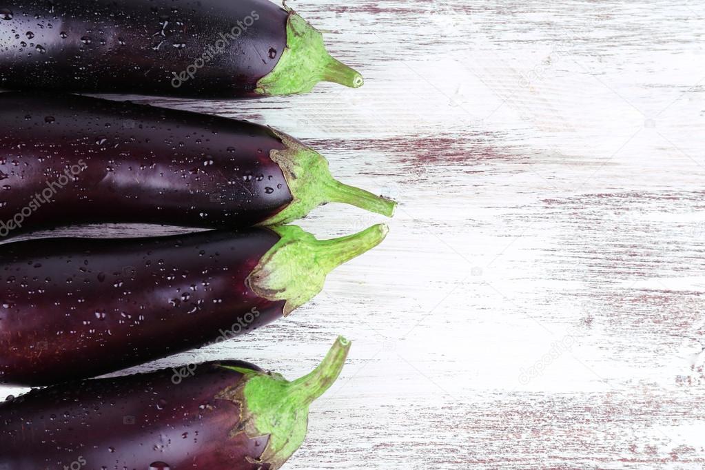 Aubergines on wooden background