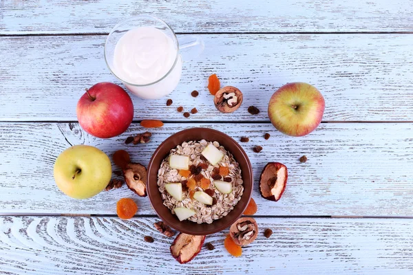 Bowl of oatmeal, walnuts — Stock Photo, Image