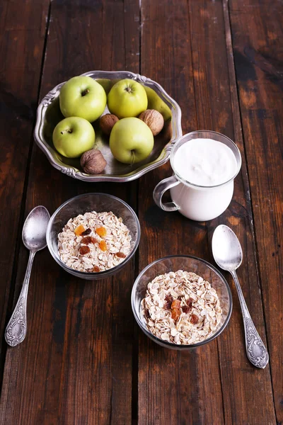 Oatmeal in bowls with apple — Stock Photo, Image